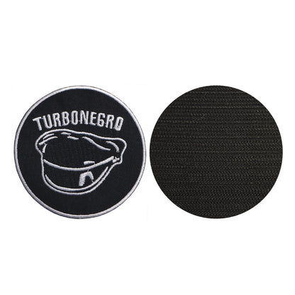 MAXIMUMPATCHES - Turbonégro - Diamètre 8 cm - Ecusson Patch Brodé Avec Scratch Cousu Au Dos + Carré Scratch A Coudre, Face Opposé 10 cm x 10 cm/Groupe Musique Métal Rock Punk Heavy Trash Blues